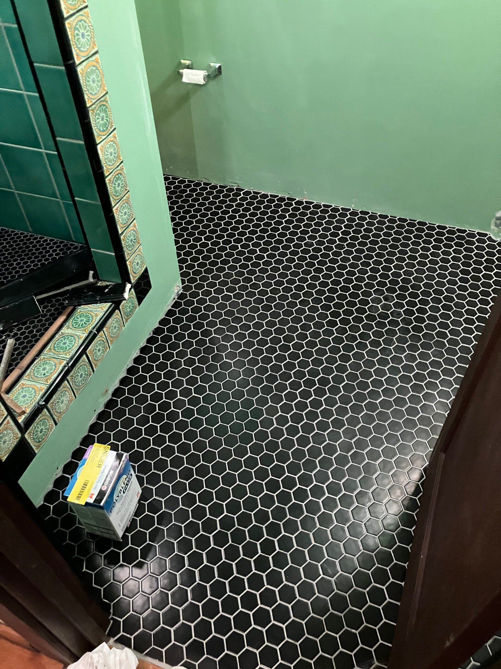 Black hexagonal mosaic tile floor in Albany
