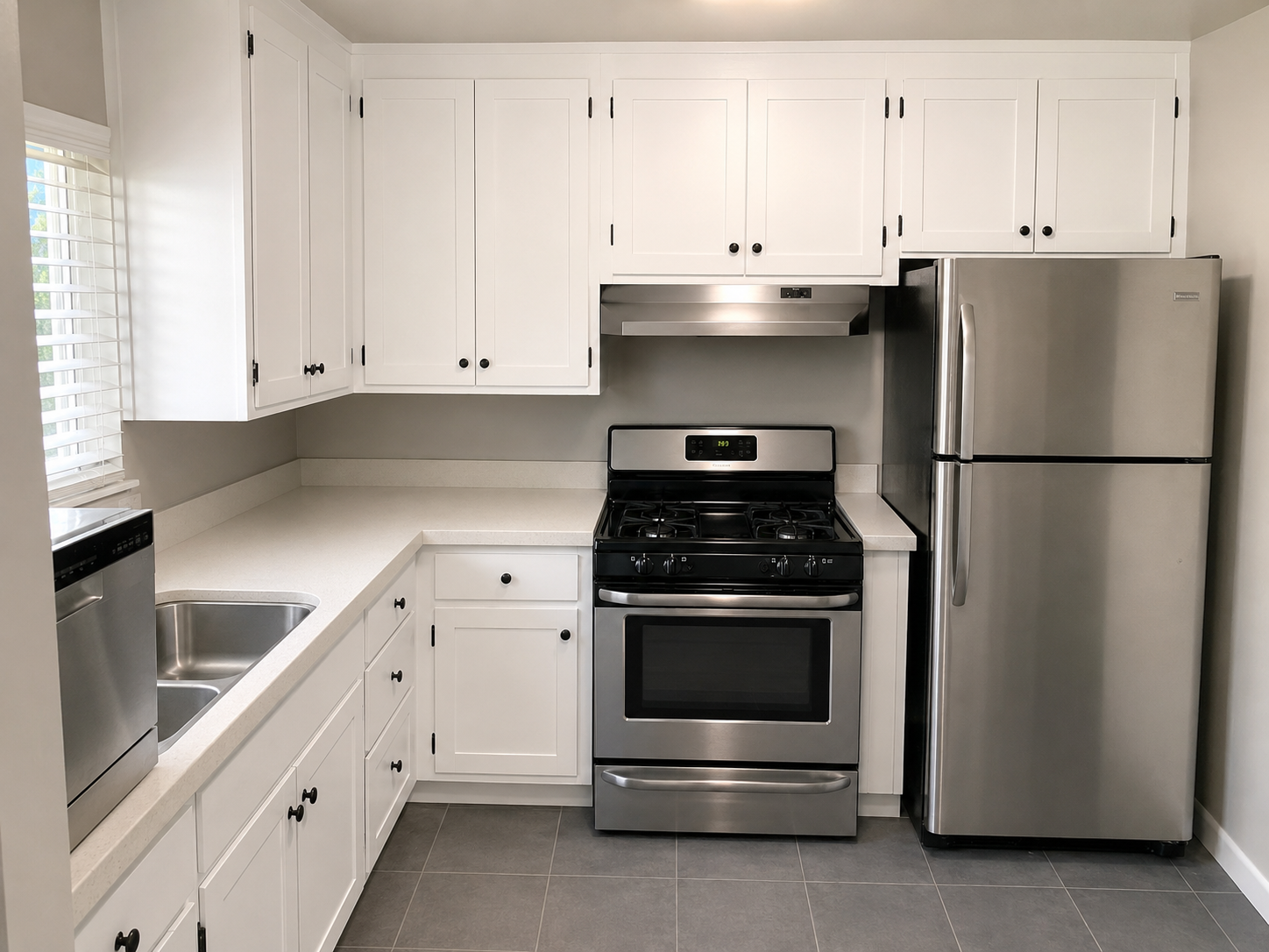Finished kitchen with new cabinets and tile floor